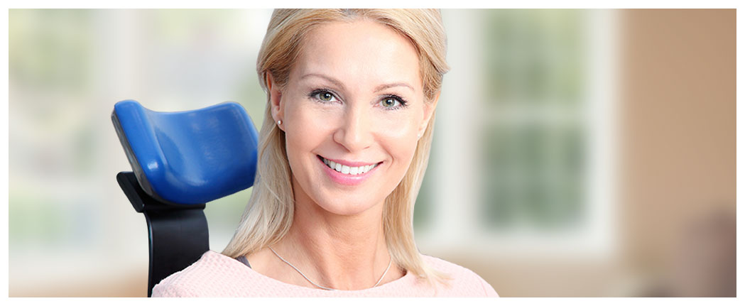 Smiling woman sitting on a chair.