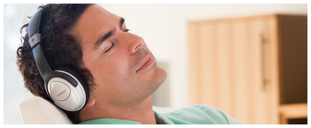 Man relaxing with headphones on.